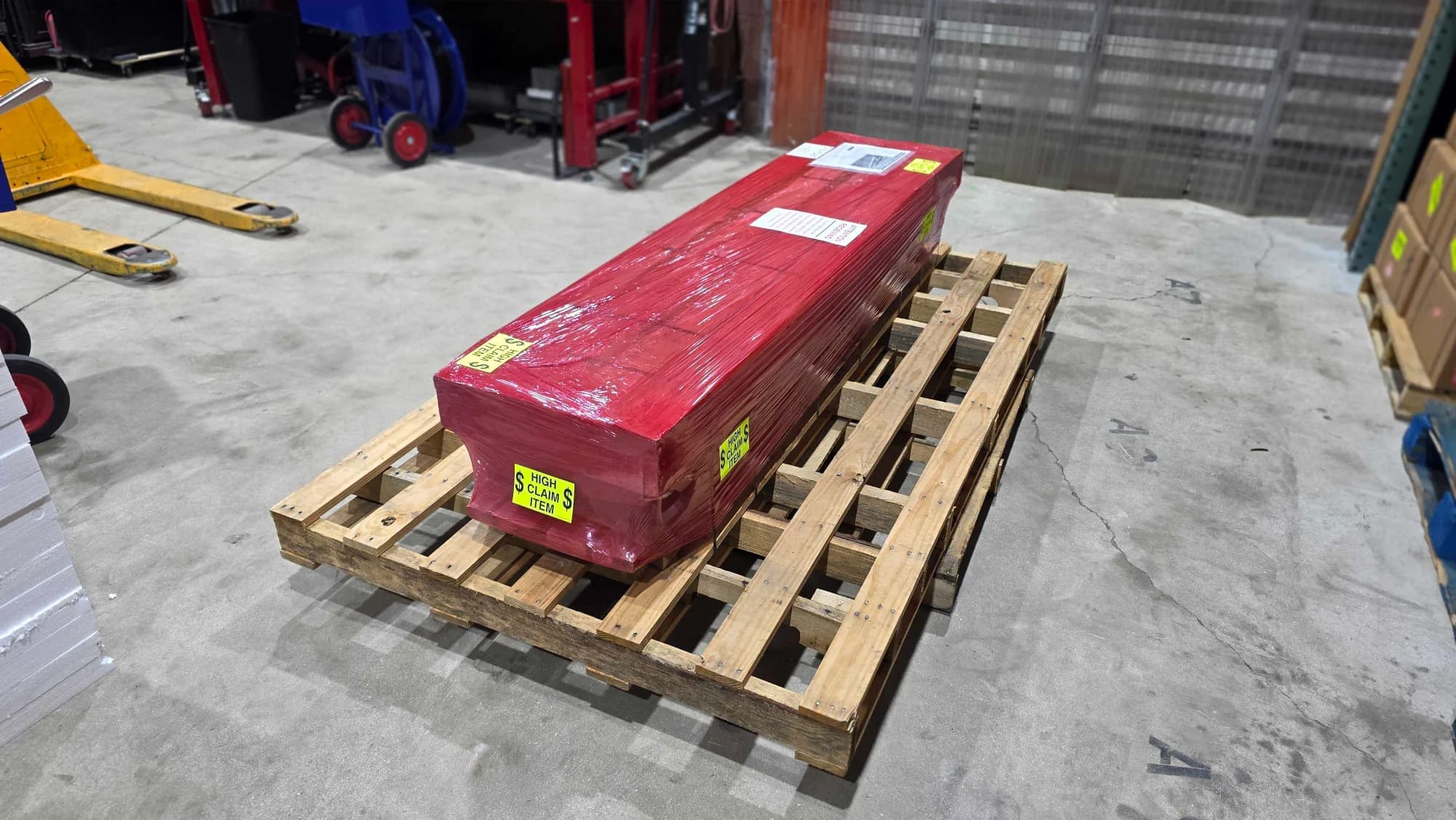 A Citizen Memorials shipment wrapped and secured on a freight pallet