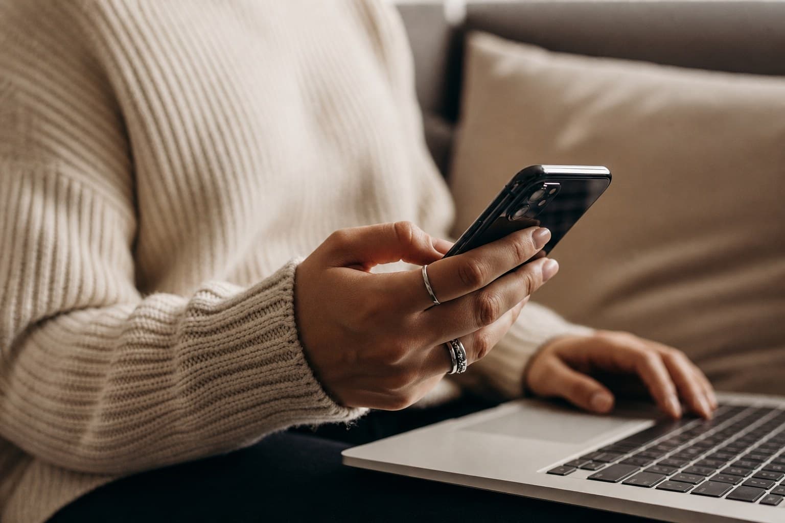 Hands holding a phone for text support