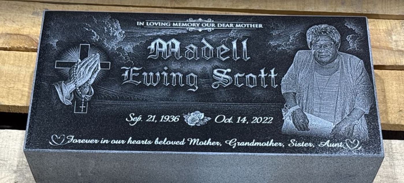 Flat marker for Madell Ewing Scott — praying hands and cross with a full-length laser-engraved portrait and 'Forever in our hearts' inscription