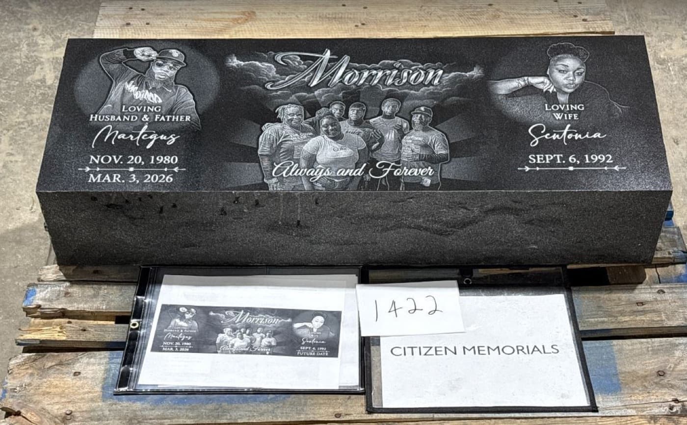 Wide companion bevel marker for the Morrison family — dual individual portraits flanking a central family group scene engraved on polished black granite